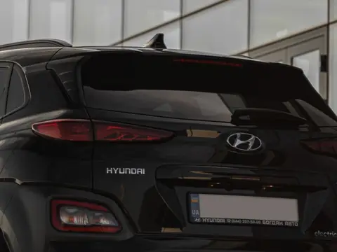 The rear window of a dark compact SUV